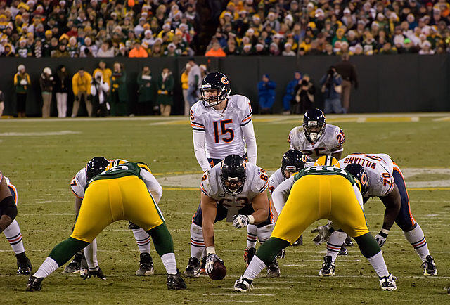 Chicago Bears and Green Bay Packers football teams facing off during a game.