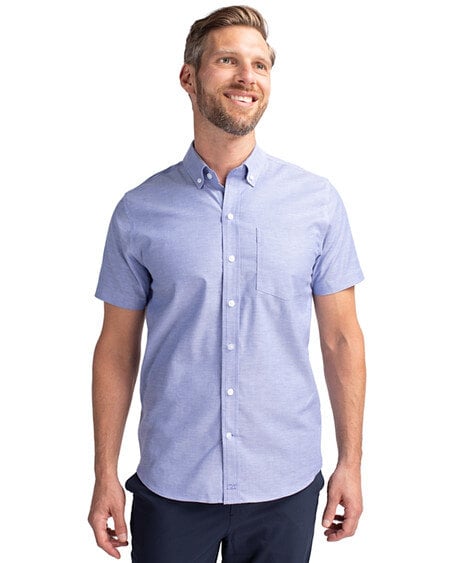 Man wearing Cutter & Buck Stretch Oxford Mens Short Sleeve Dress Shirt in French Blue
