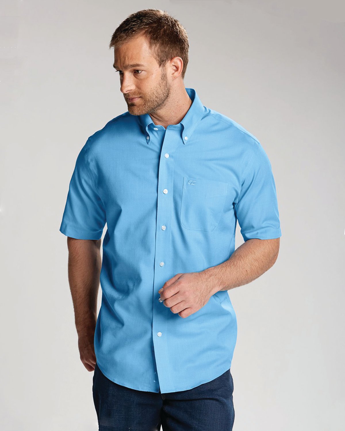 Man wearing a breathable and comfortable Cutter & Buck Epic Easy Care Nailshead Mens Short Sleeve Dress Shirt 