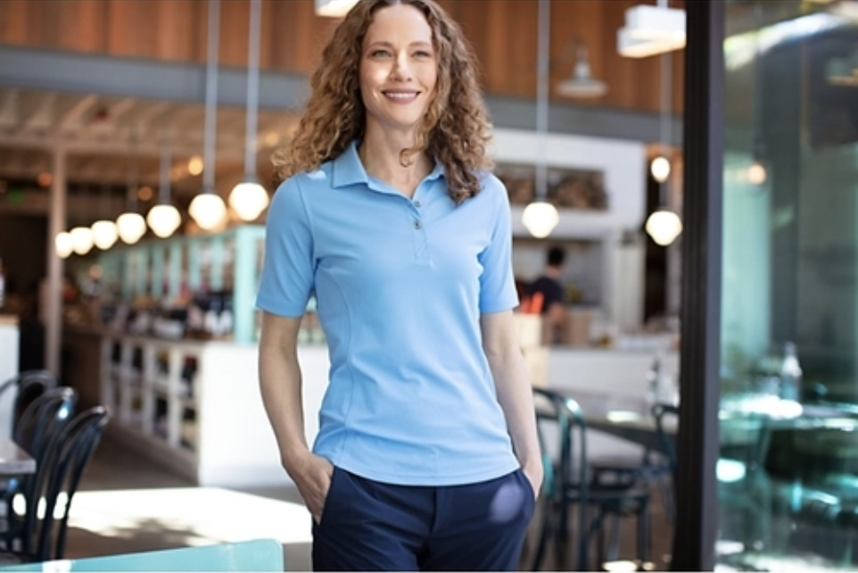 Woman Wearing Cutter & Buck Virtue Eco Pique Recycled Polo