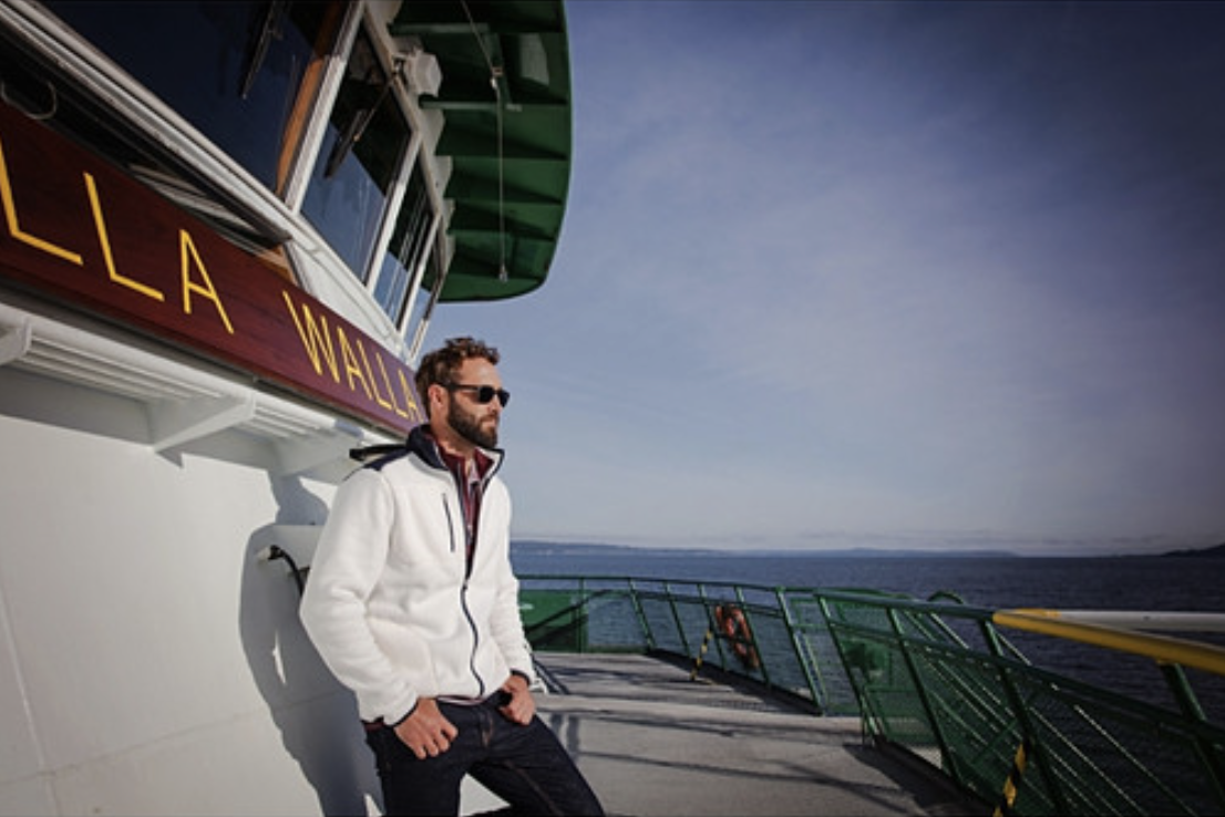 Man on a boat wearing Cutter & Buck Cascade Eco Sherpa Mens Fleece Jacket