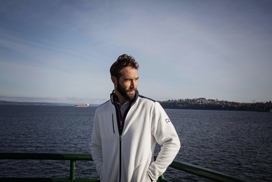 Man on a boat wearing a Cutter and Buck sherpa fleece