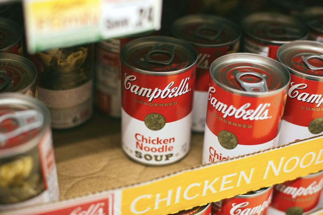 cans of chicken noodle soup on a shelf