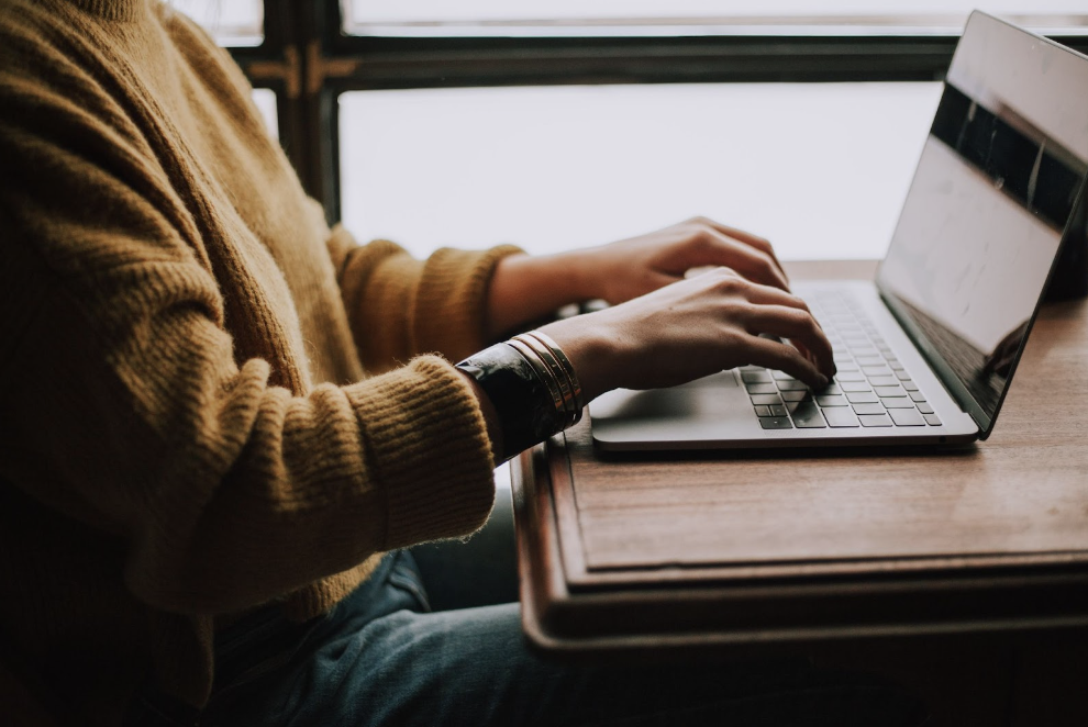 person typing on a computer