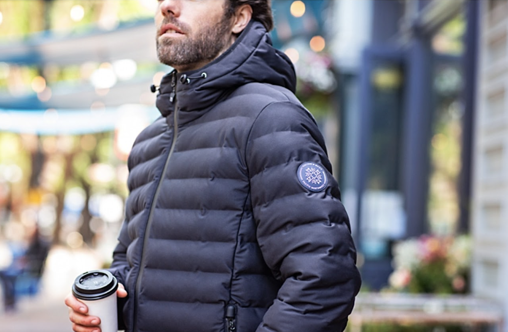 Man outside drinking coffee wearing Cutter & Buck Mission Ridge Repreve® Eco Insulated Mens Puffer Jacket