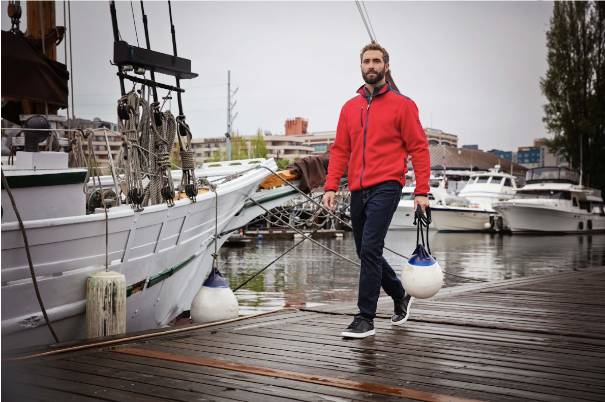 man on a dock wearing an eco sherpa jacket