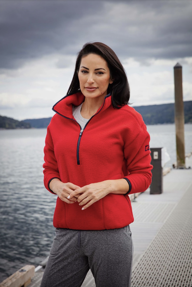 woman outside on dock wearing cutter and buck sherpa pullover