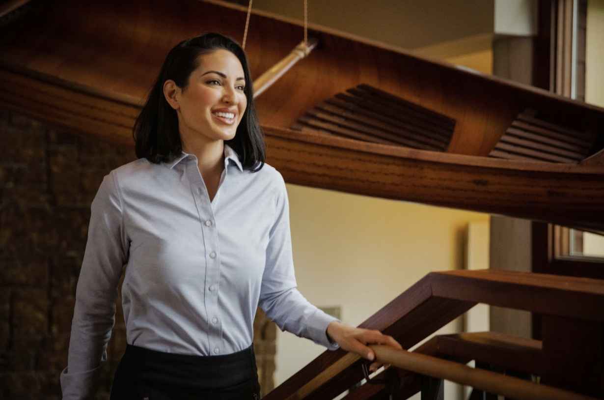 woman in office wearing cutter and buck dress shirt