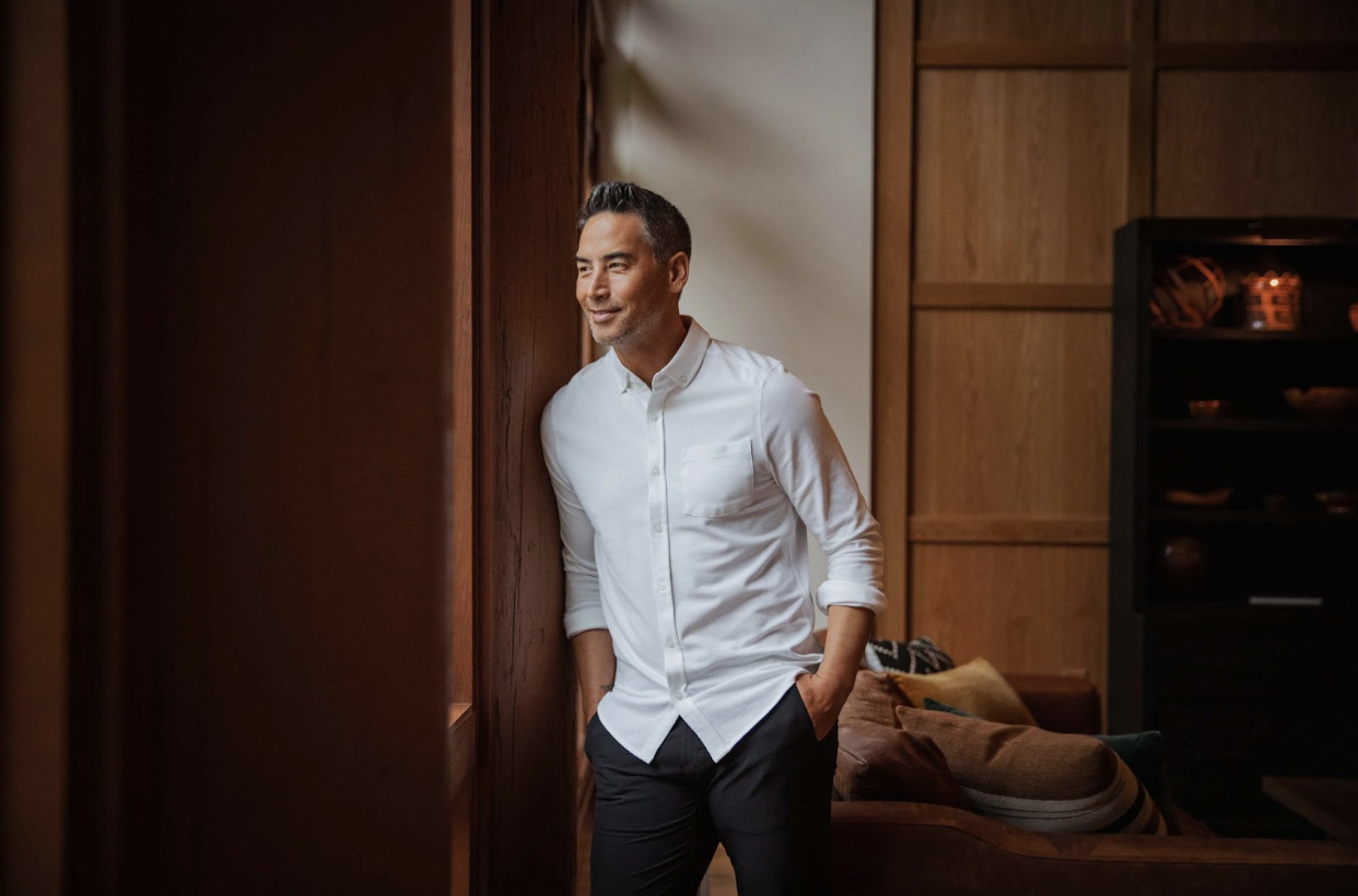 man in office wearing cutter and buck dress shirt