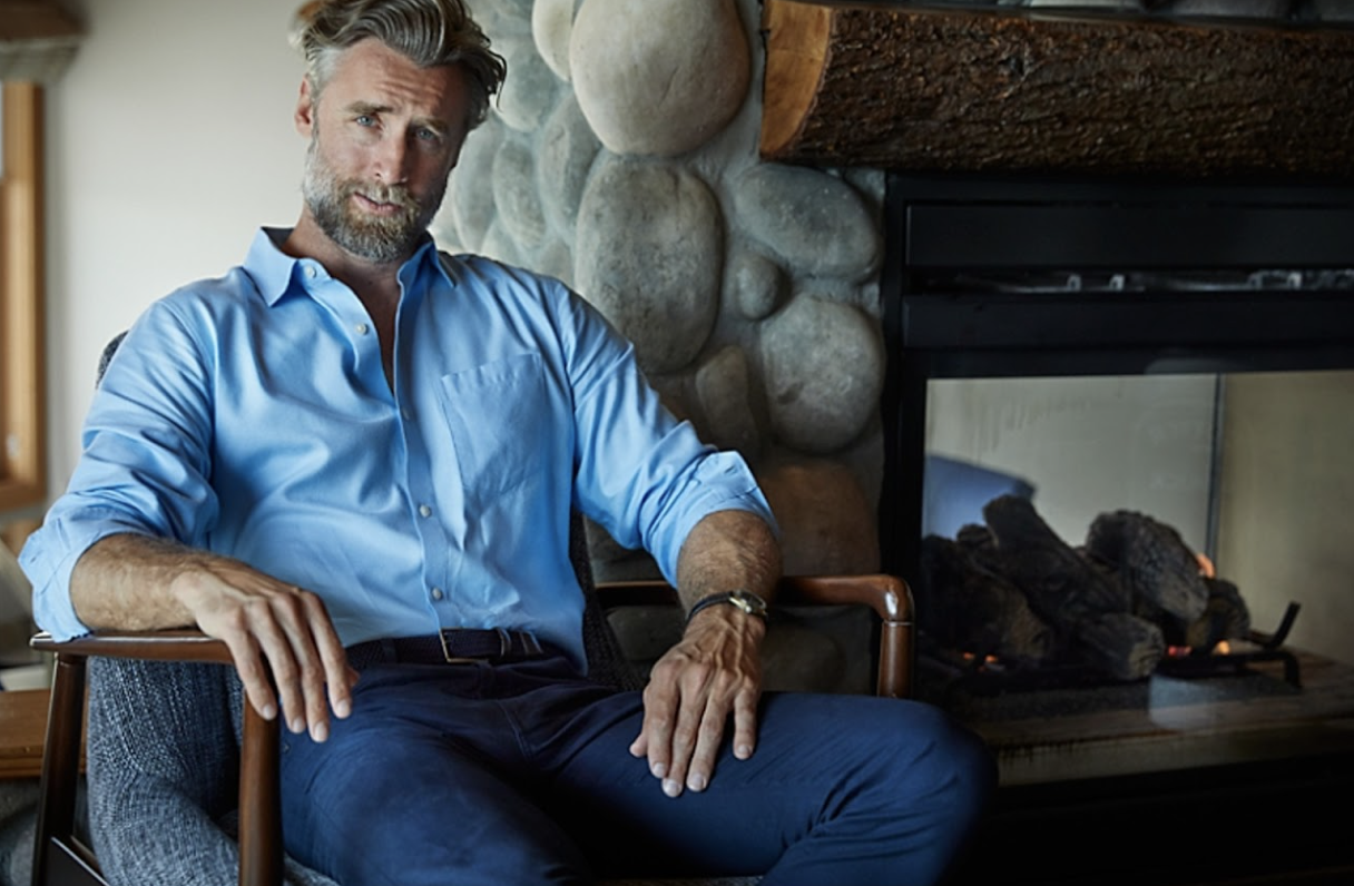 man in office wearing cutter and buck dress shirt