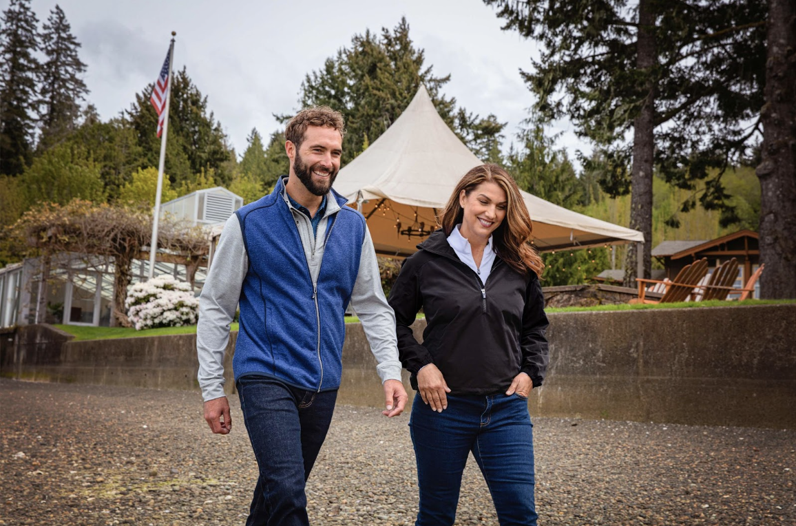 two people on a hike wearing cutter and buck jackets