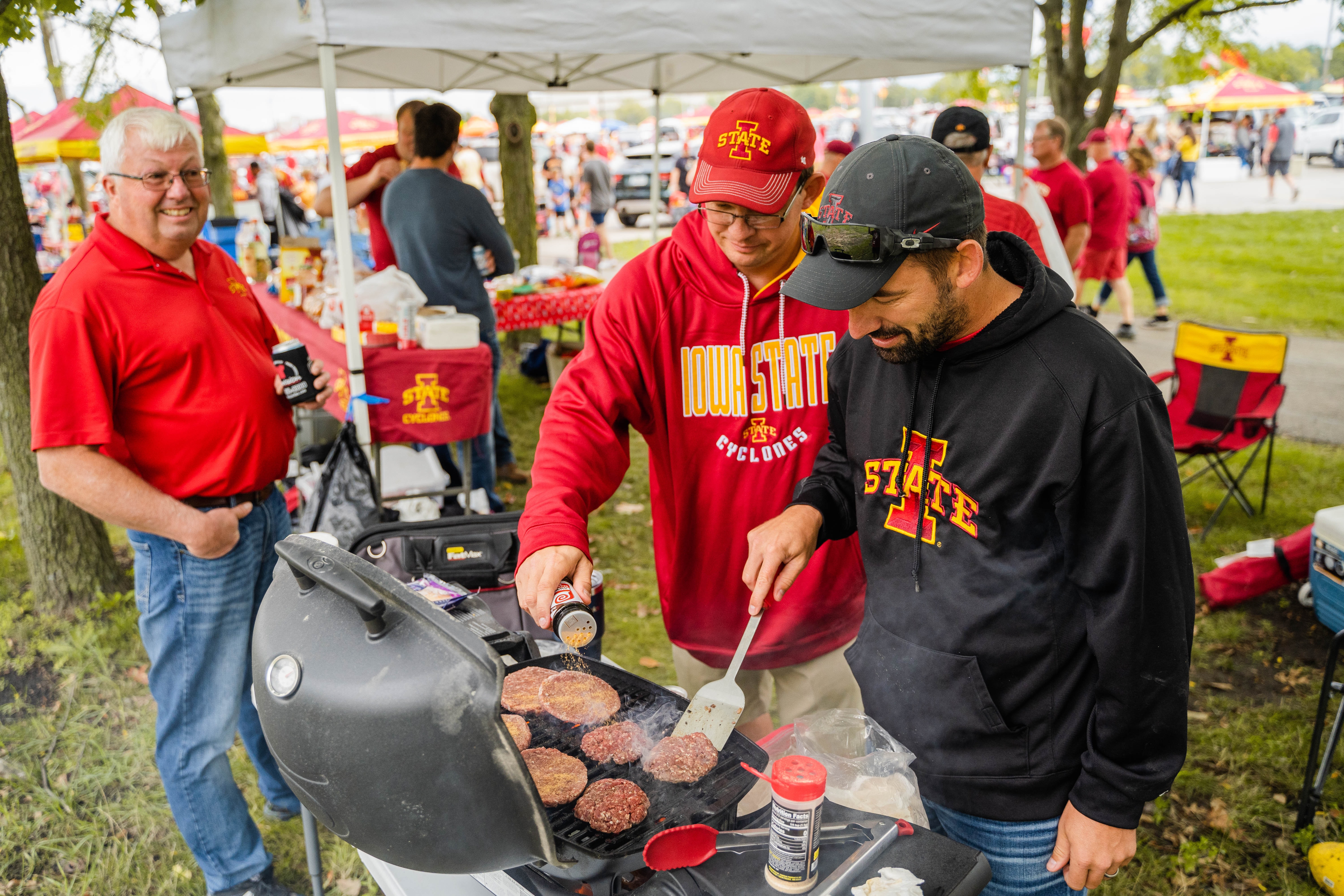 Football Fans Grilling at a Tailgate