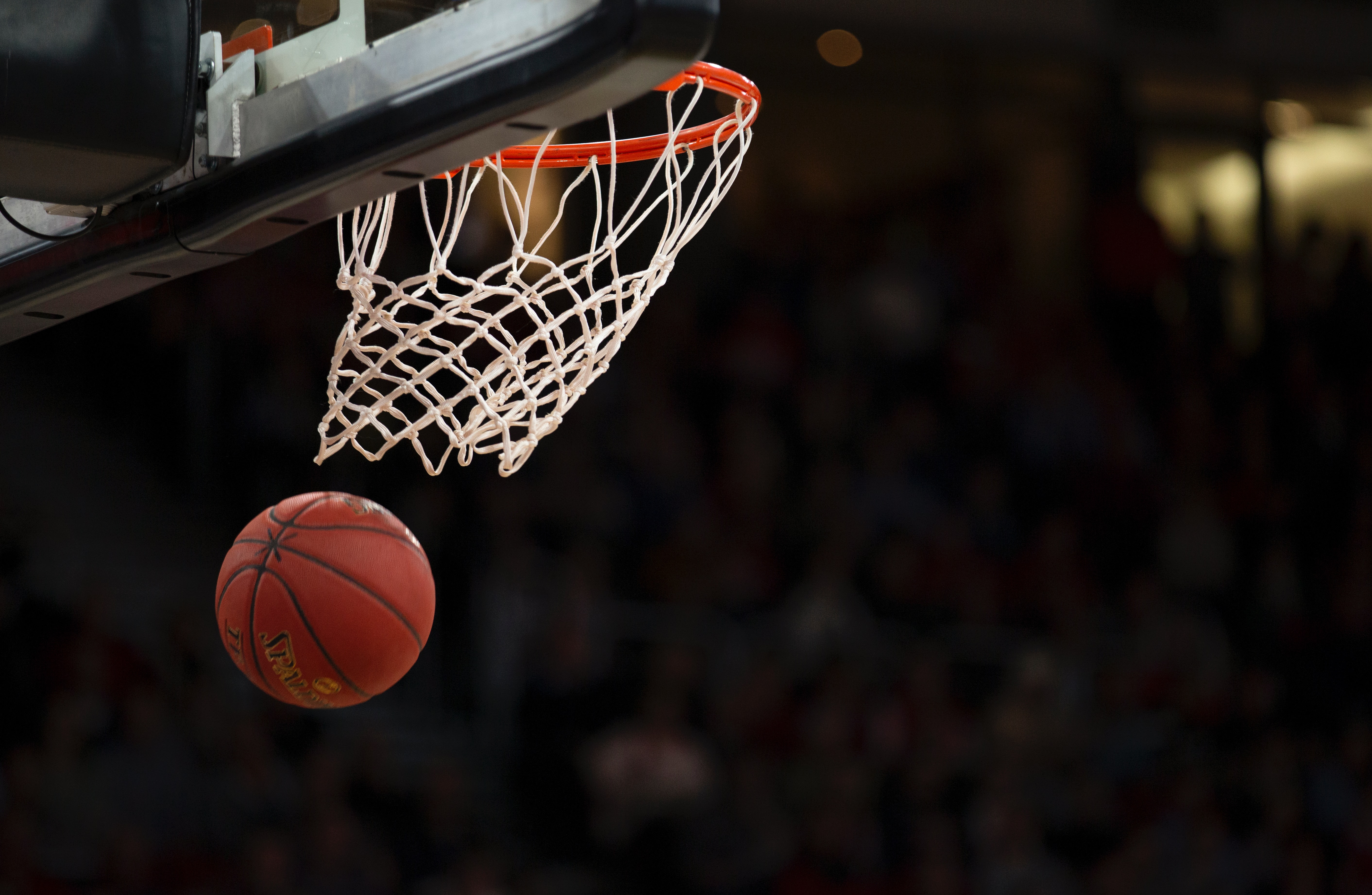 a basketball swishing into the net