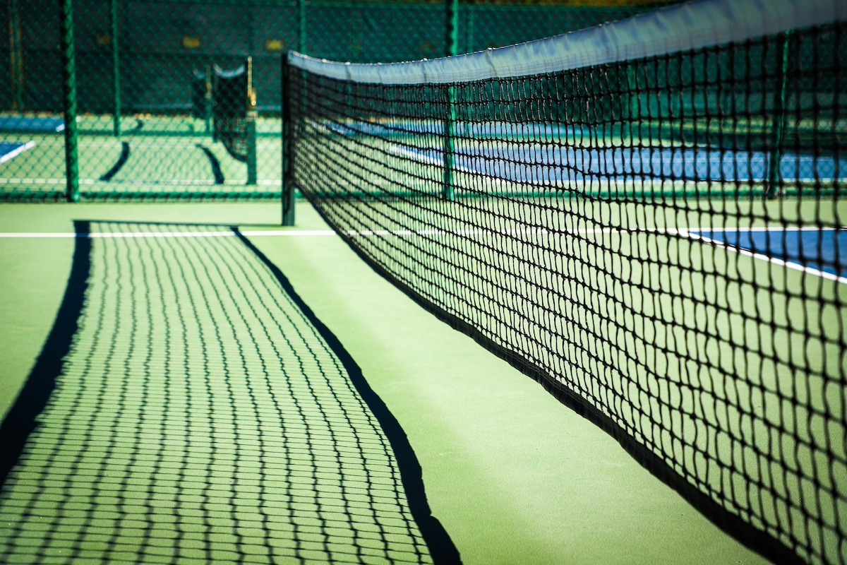 Close up of pickleball nets and courts